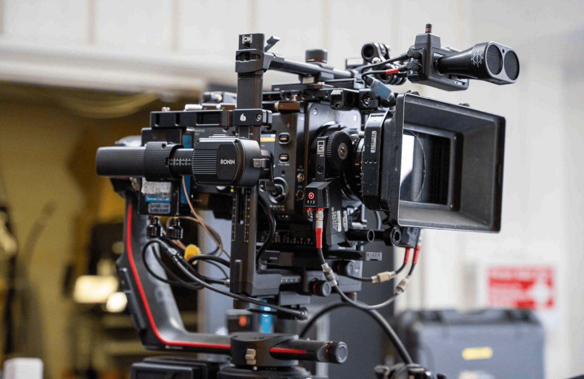 FX Productions Canada Professional cinema camera rig equipped with various accessories, including microphones and stabilizers, set up indoors for filming by FX Productions Canada, a leading Toronto Production Company. Toronto Video Production Company
