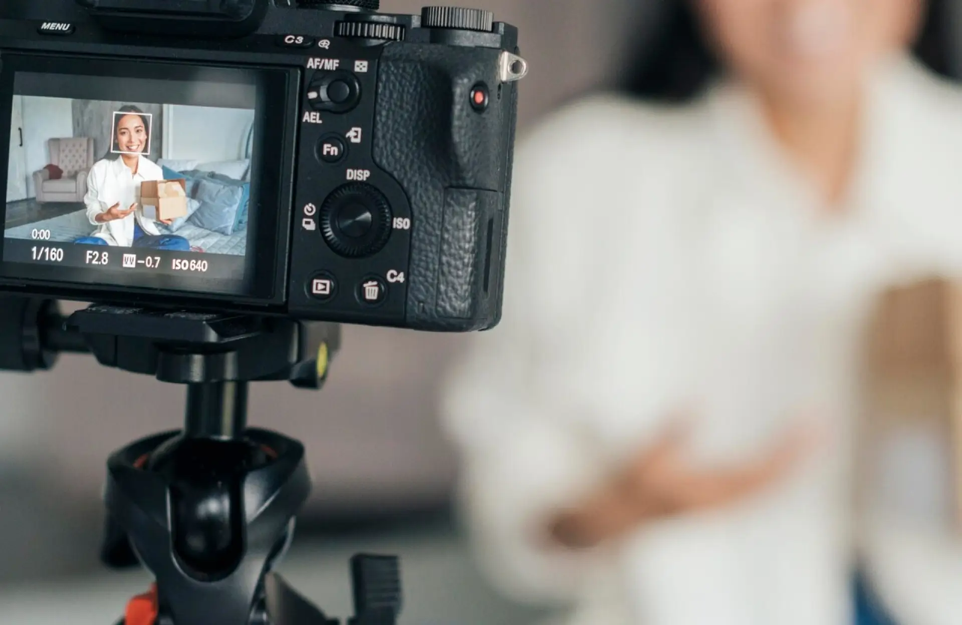 FX Productions Canada A camera records a person holding a box, with the individual visible both in front of the camera and on its display screen. Toronto Video Production Company