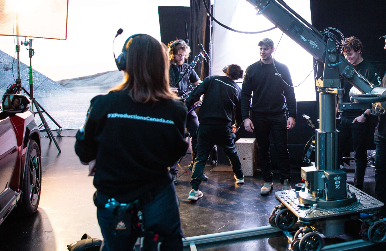 FX Productions Canada A film crew from a video production company in Toronto works on set with lighting equipment, a camera crane, and several crew members adjusting gear and preparing for a multi-channel marketing commercial video shoot. Toronto Video Production Company